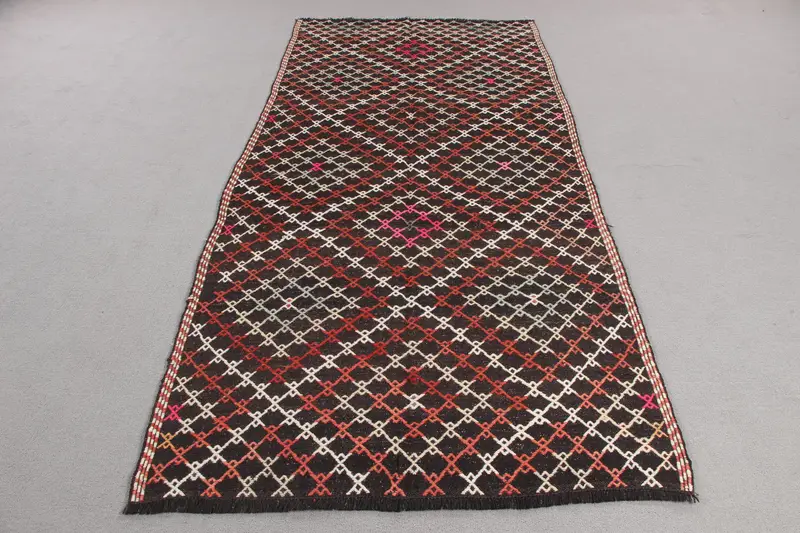 Elegant Black Rug, 4x8.5 ft with Orange Accents