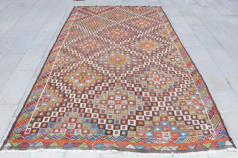 Alfombra Ikat morada, 6,7x11,6 ft con detalles en verde