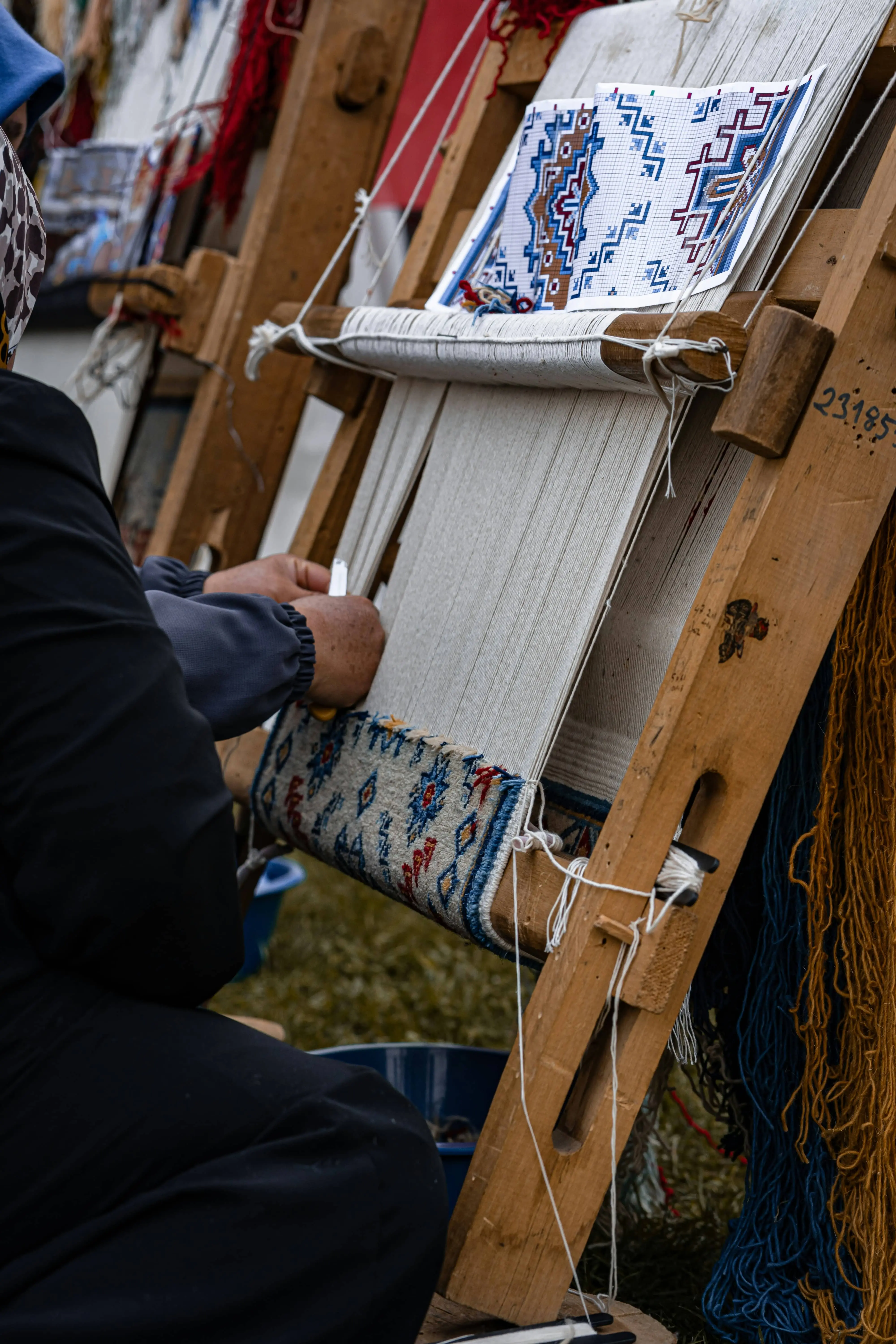 Artisan weaving a handmade textile