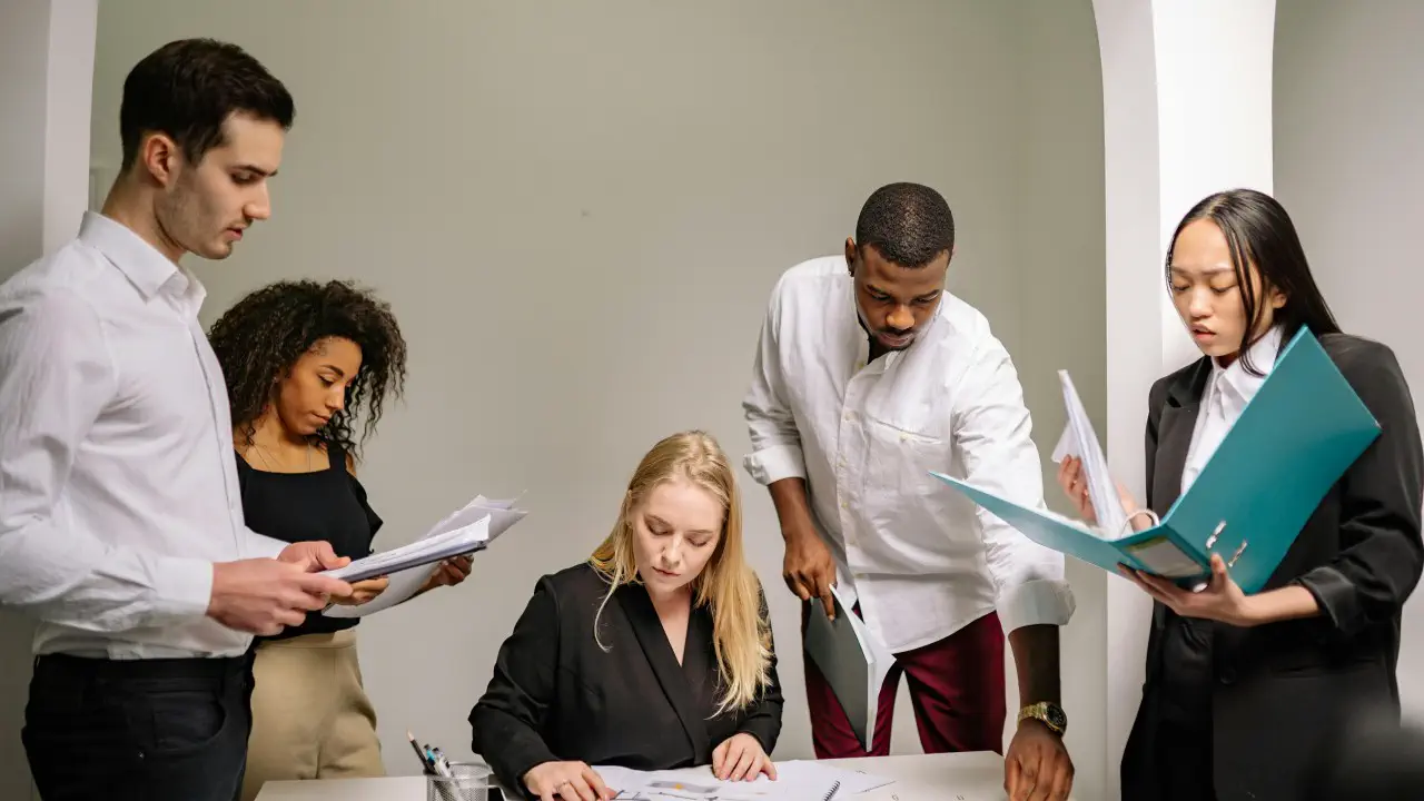 Team reviewing business plans together